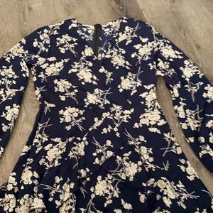 Navy blue mini dress with white tiny flowers on the dress v shape